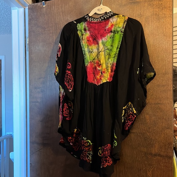 A black top with elephants, and then embroidery around the elephant and neckline - Picture 5 of 5